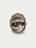 Antiqued silver concho scarf slide with oval bar and engraved brand text