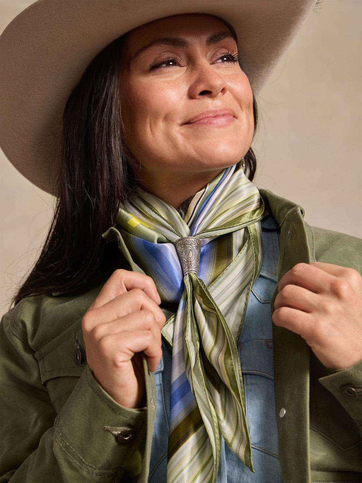 Wild rag scarf close-up with green yellow blue stripes and tied knot