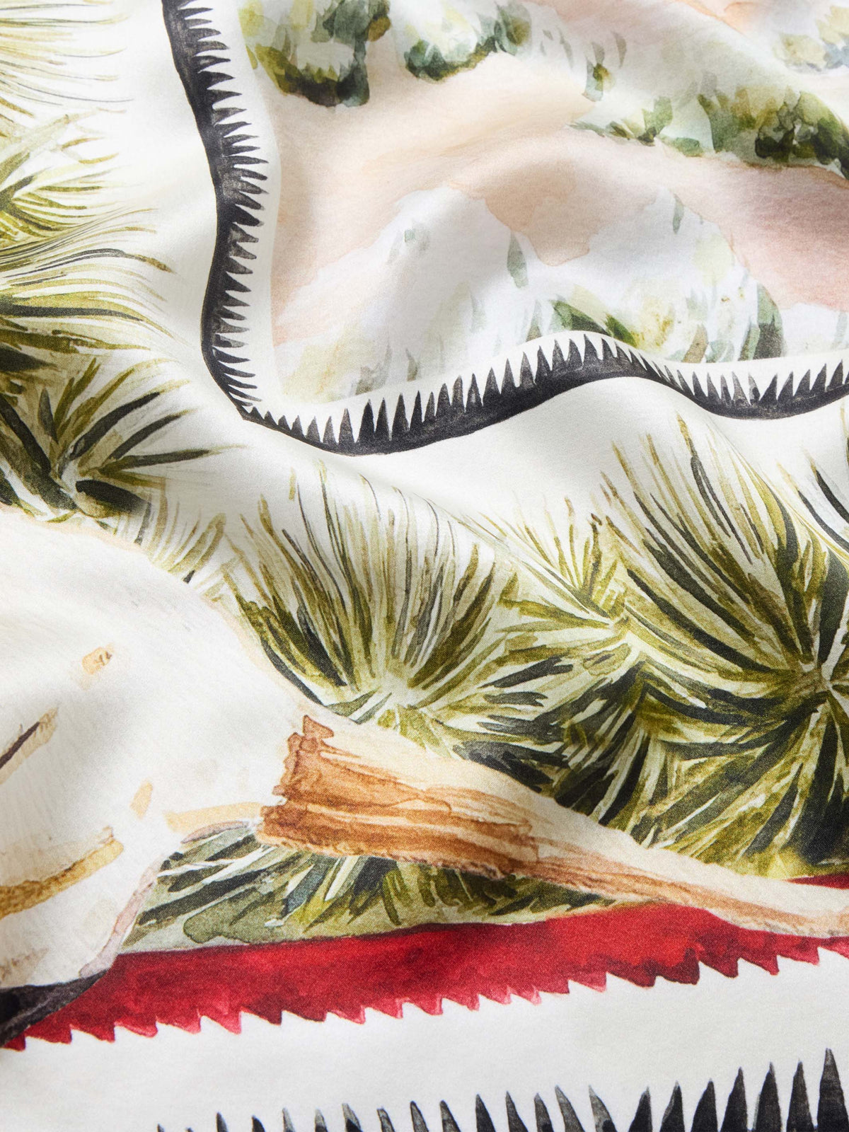 Southwest Spirit wild rag with palm and desert prints, red zigzag border, black trim