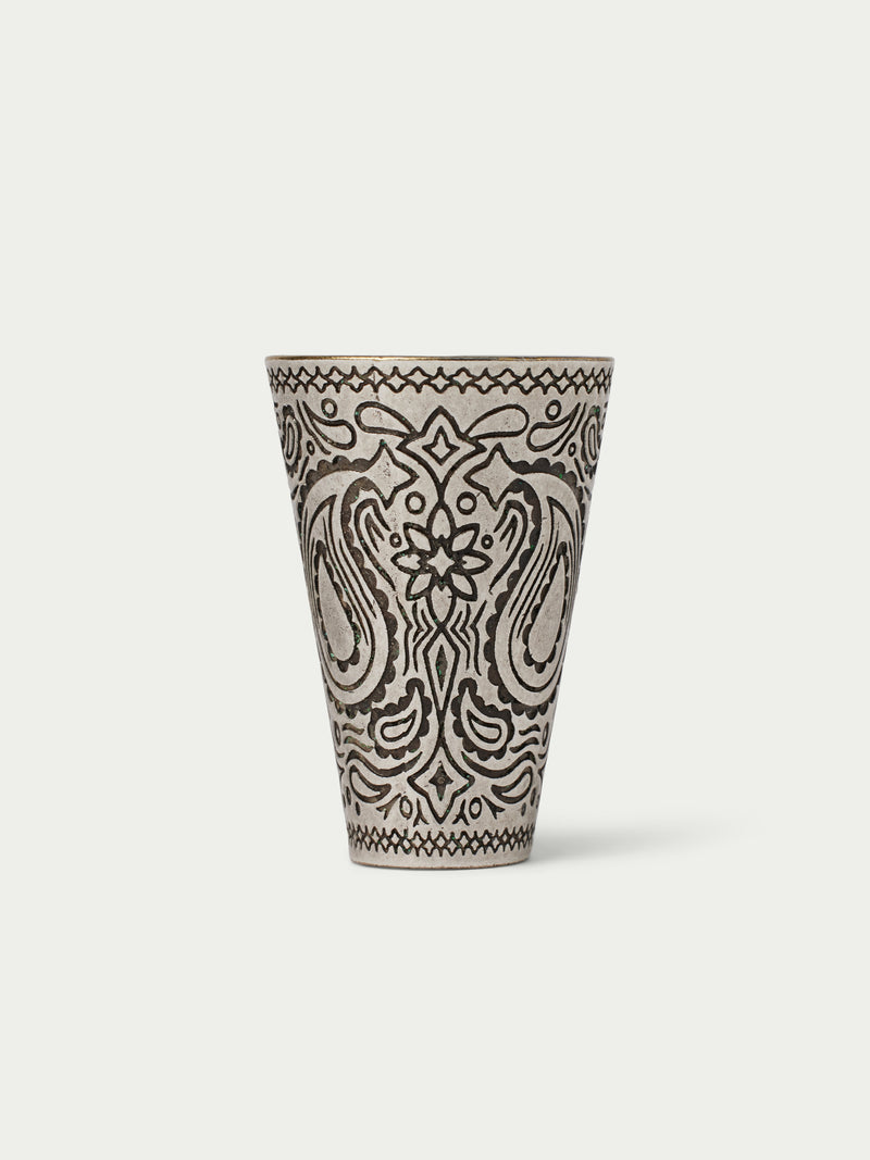 Paisley-patterned cone cup with black line art on a cream base, top rim visible