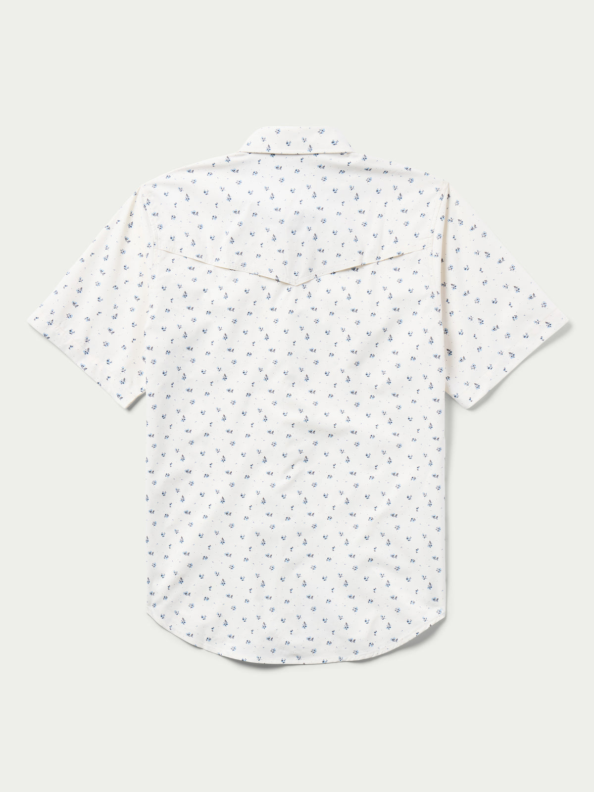 Short-sleeve pearl snap shirt in white with small blue floral pattern, button placket.