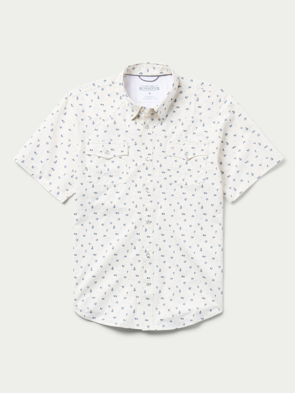 Short-sleeve pearl snap shirt in white with small blue floral pattern, chest pockets.