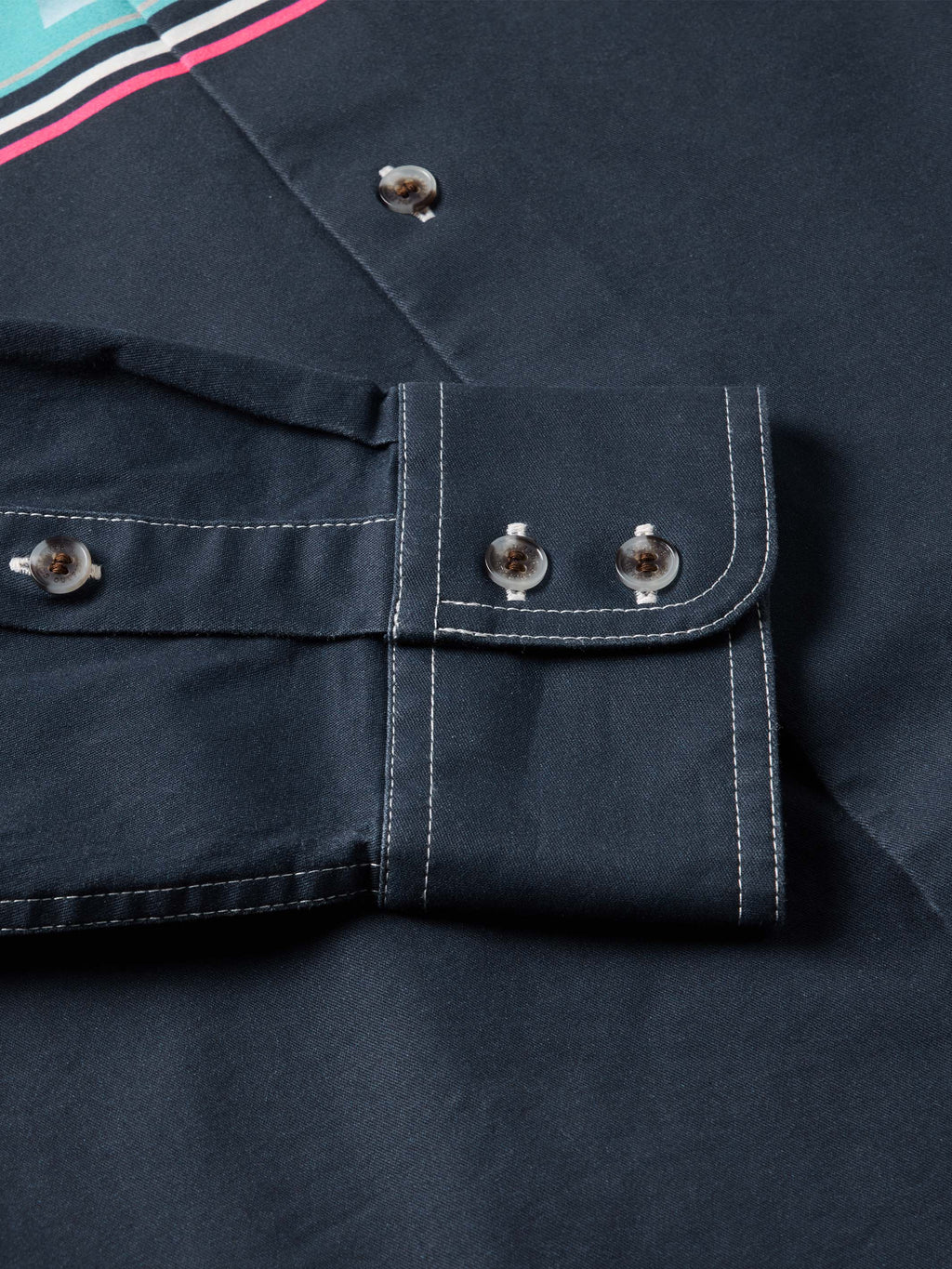 Dark navy button-down shirt: close-up of chest pocket and contrast topstitching