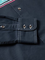 Dark navy button-down shirt: close-up of chest pocket and contrast topstitching