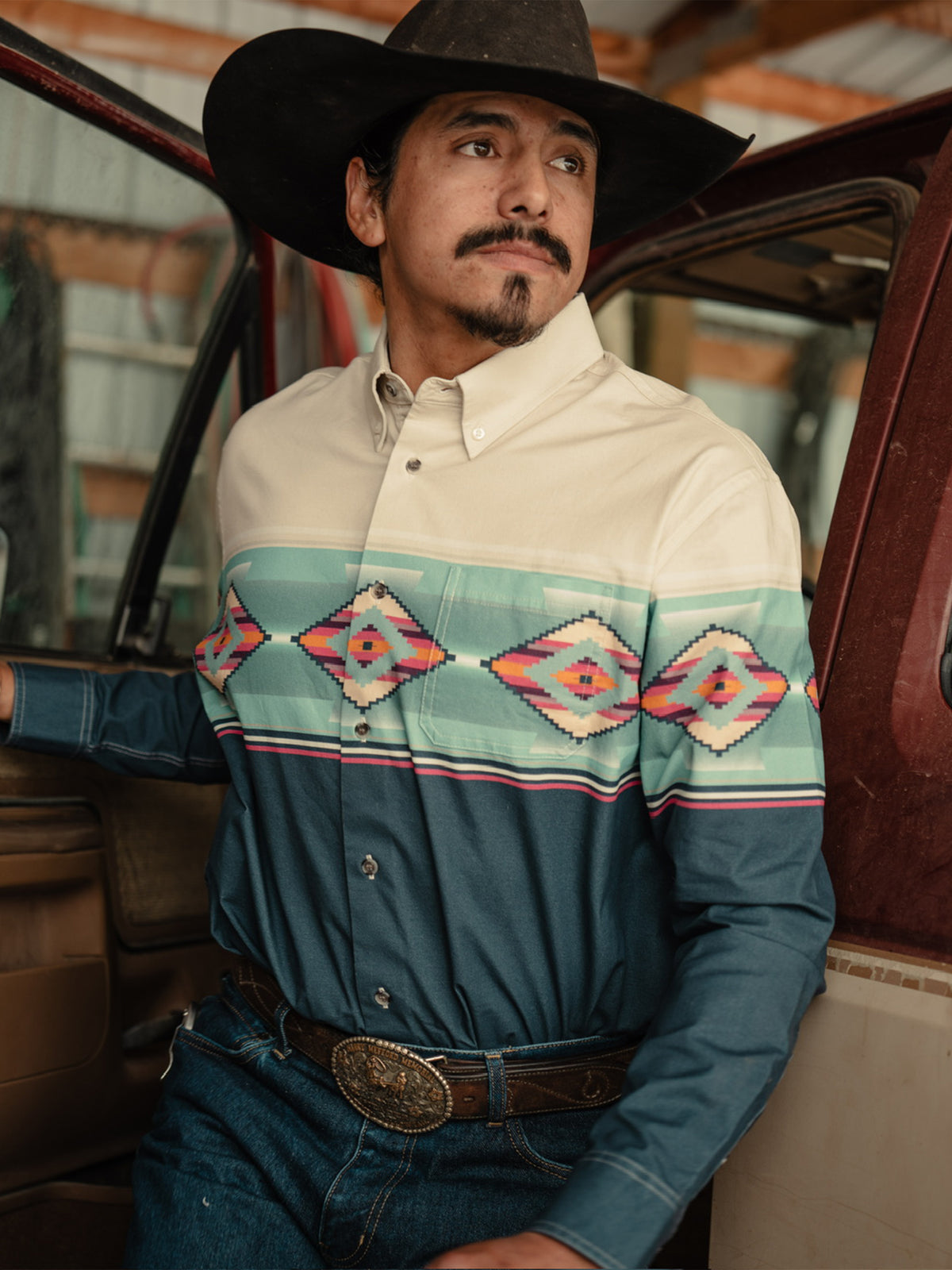 Men's button-down shirt on model: cream collar with turquoise diamond stripe across chest
