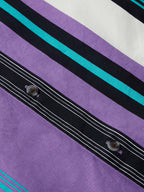 Placket view with dark stripes and round buttons on purple striped shirt