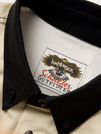 90's button-down shirt neckline with interior brand label and black button placket