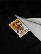 90's button-down shirt with black fabric, gray collar, and multicolor brand label