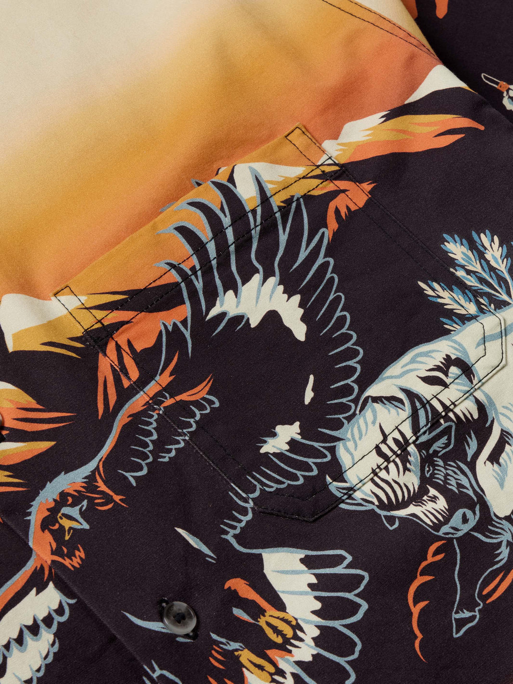 90's button-down shirt print close-up with colorful animal wings and dark background