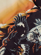 90's button-down shirt print close-up with colorful animal wings and dark background