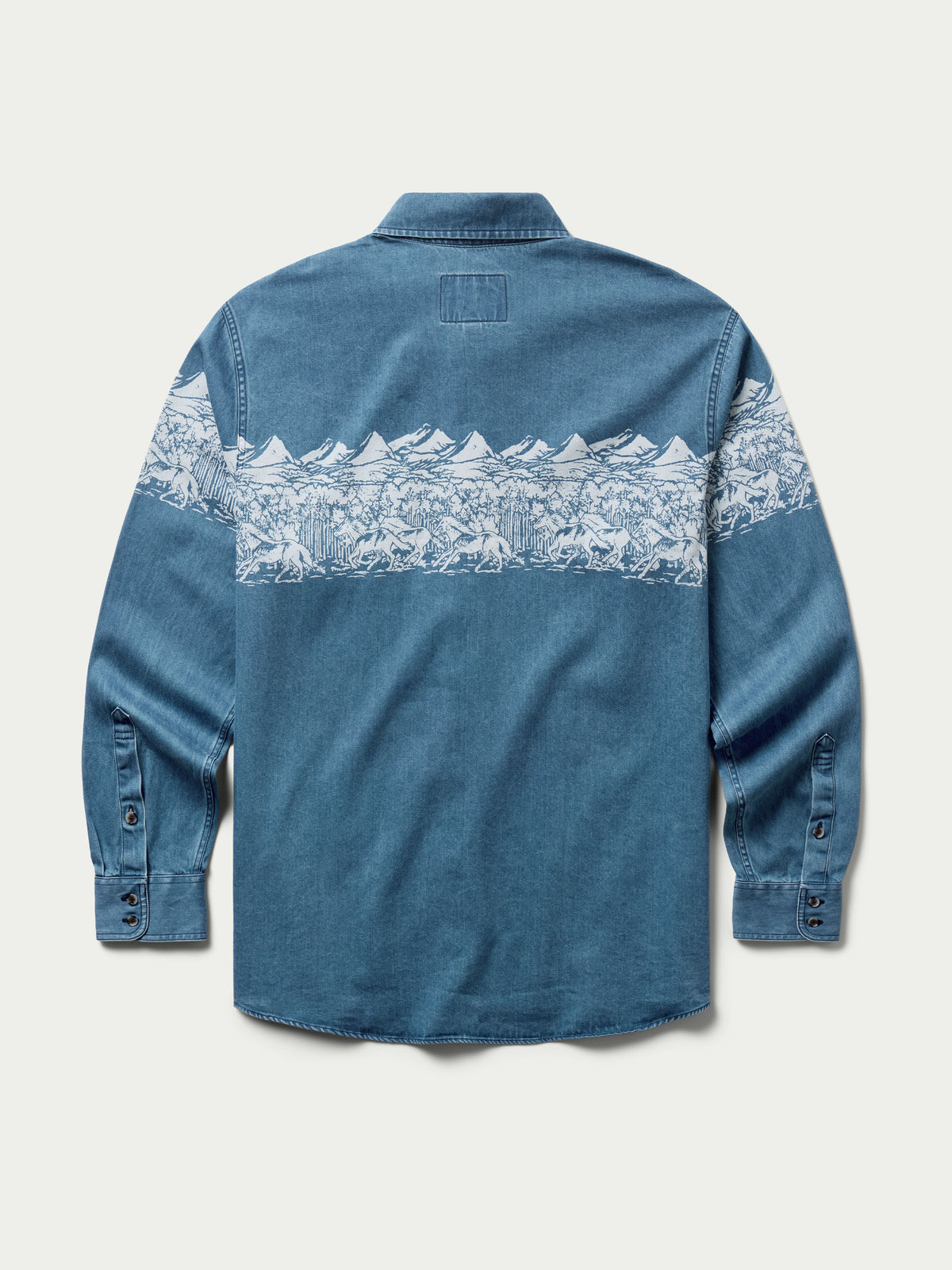 Light blue denim button-down shirt, back view, with horizontal mountain print strip