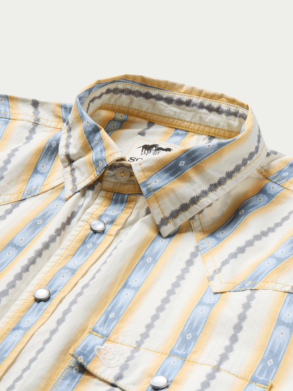 Cotton snap shirt detail: point collar, light blue and white vertical stripe with white snap placket