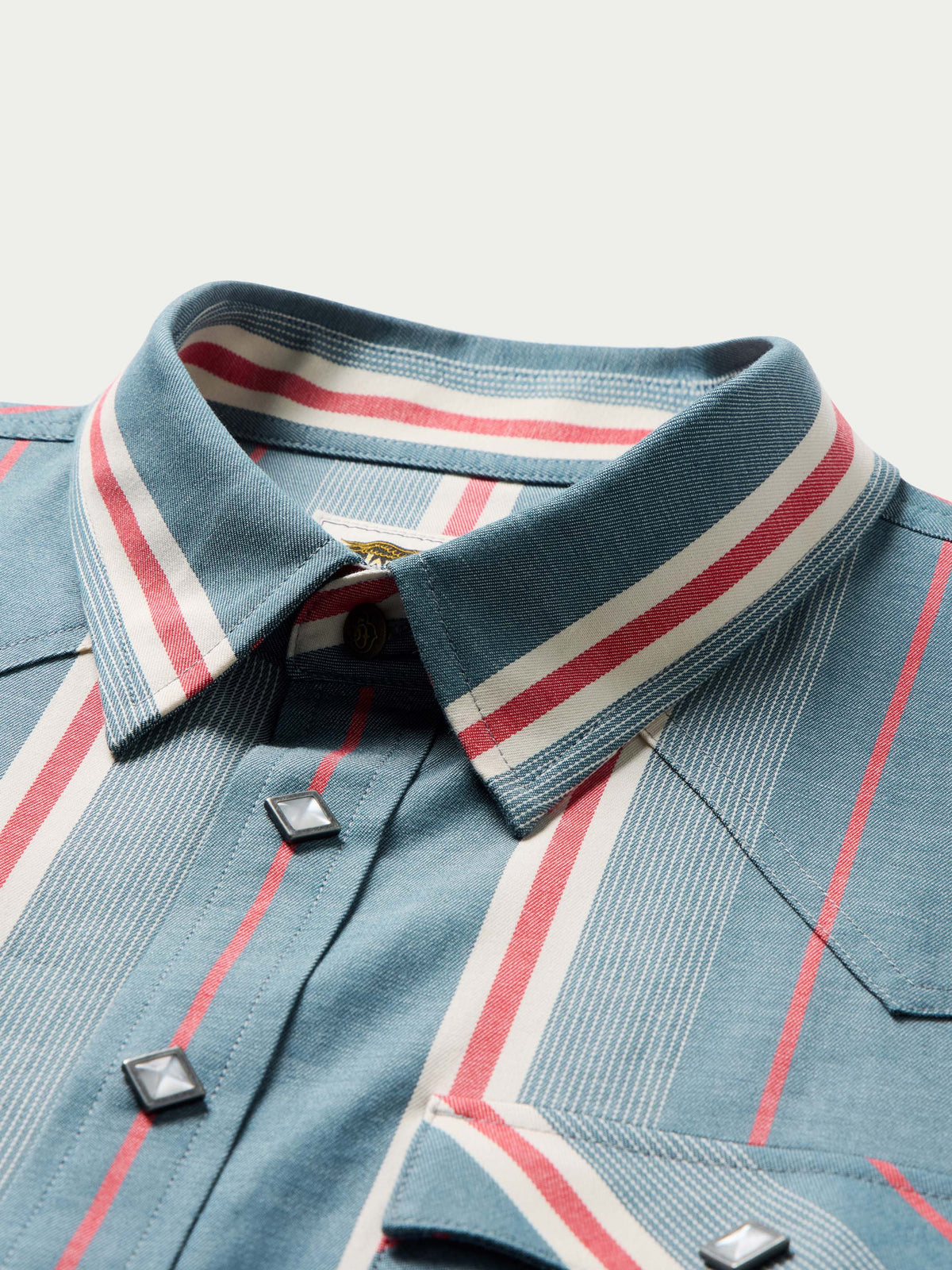 Western snap shirt collar with red and white striped inner placket and front buttons