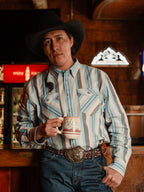 Light blue striped western snap shirt worn with long sleeves and snap front placket