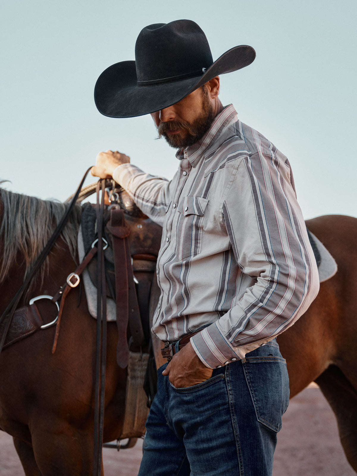 Beige striped western snap shirt with flap chest pockets and long sleeves