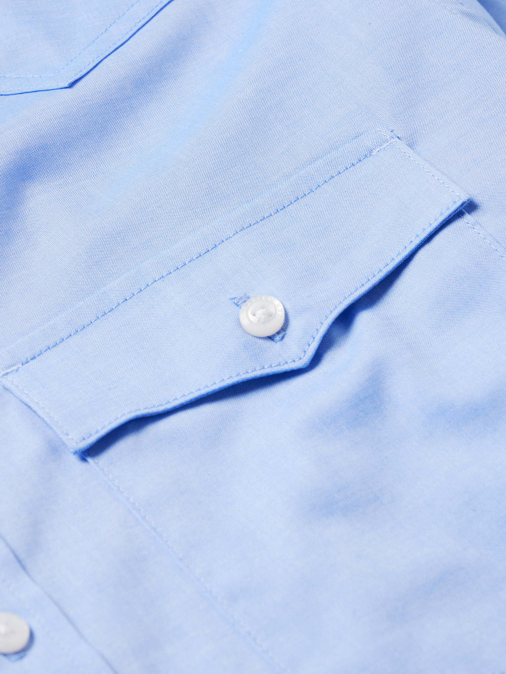 Light blue pinpoint button-down shirt cuff with white button detail