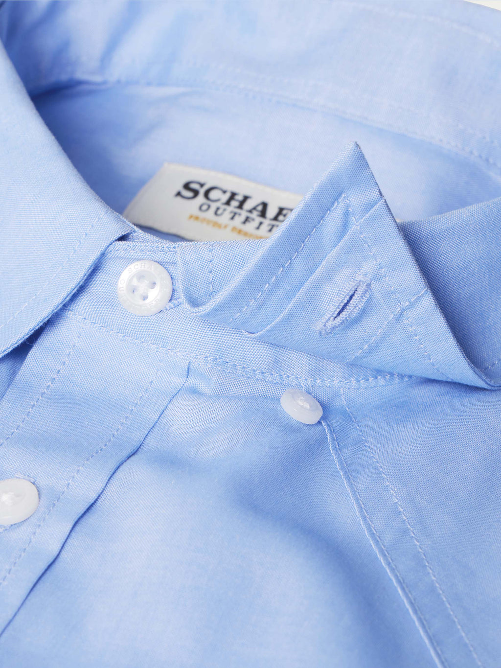 Light blue western button-down shirt collar area with inner neck label
