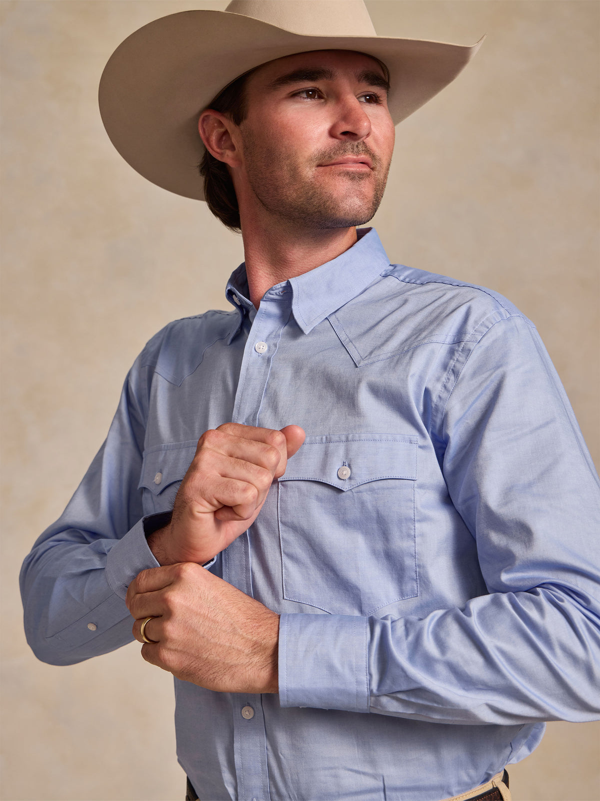 Light blue pinpoint button-down shirt with chest pocket and button cuffs
