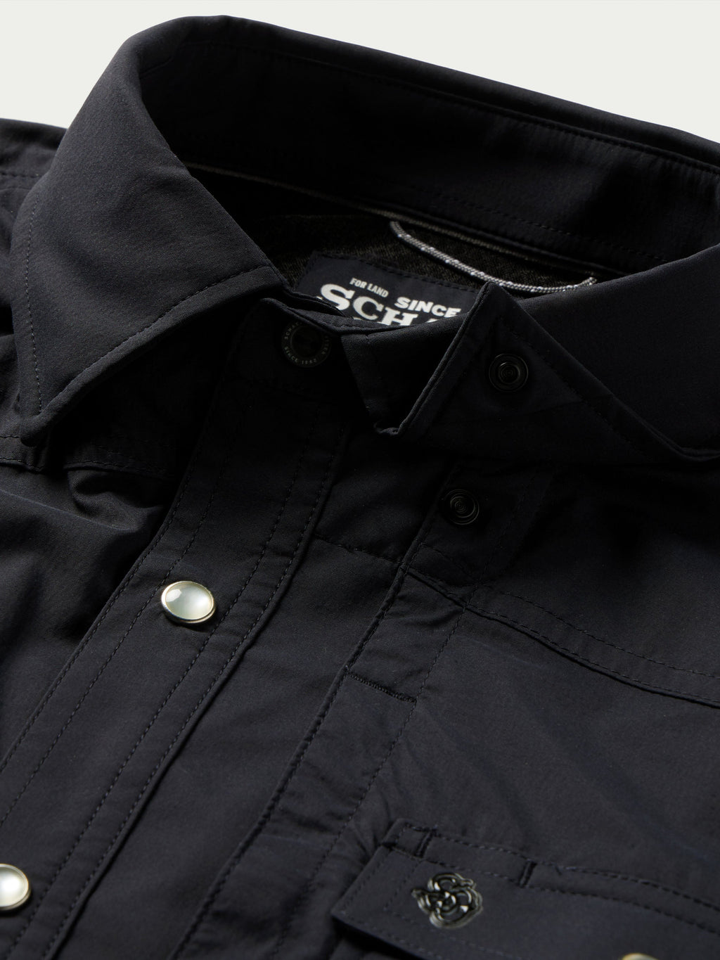 Black western snap shirt close-up of inside collar label and snap placket