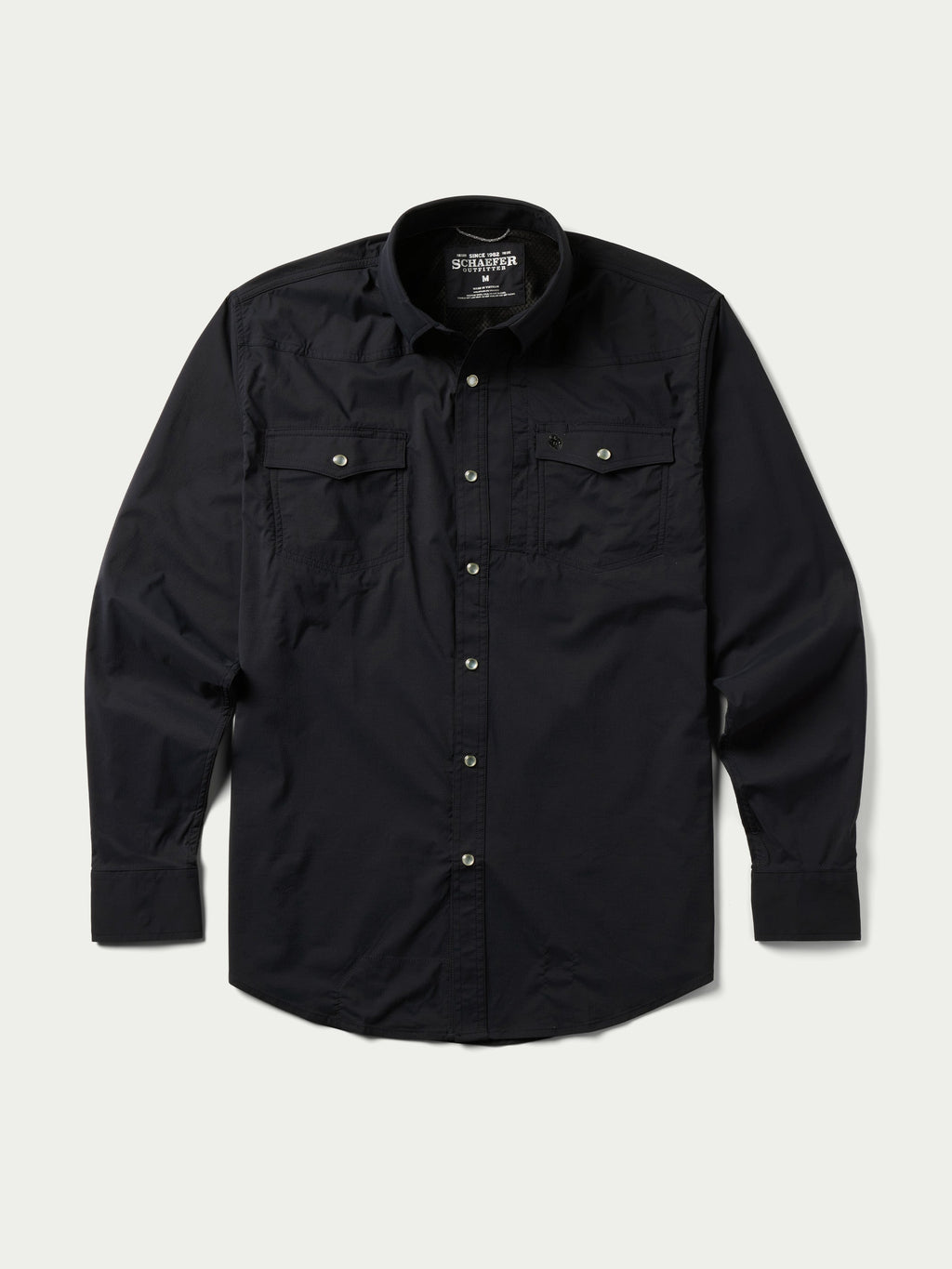Black western snap shirt with button front, snap-flap chest pockets, and long sleeves