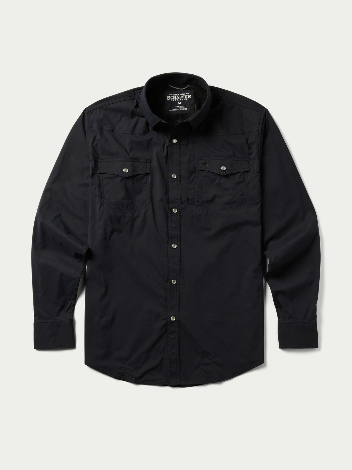 Black western snap shirt with button front, snap-flap chest pockets, and long sleeves