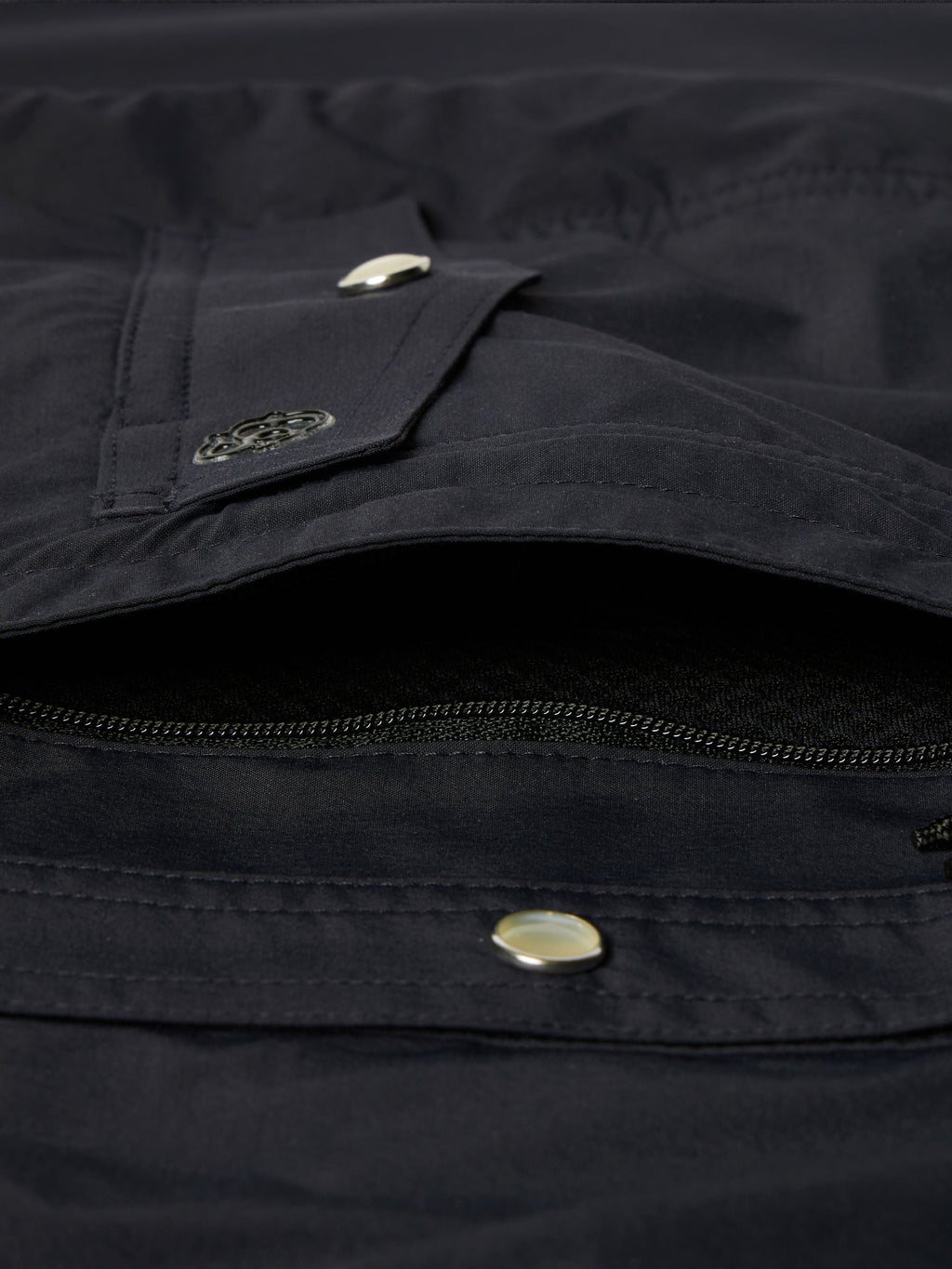 Black western snap shirt close-up of chest pocket flap with metal snap