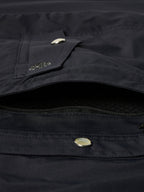 Black western snap shirt close-up of chest pocket flap with metal snap