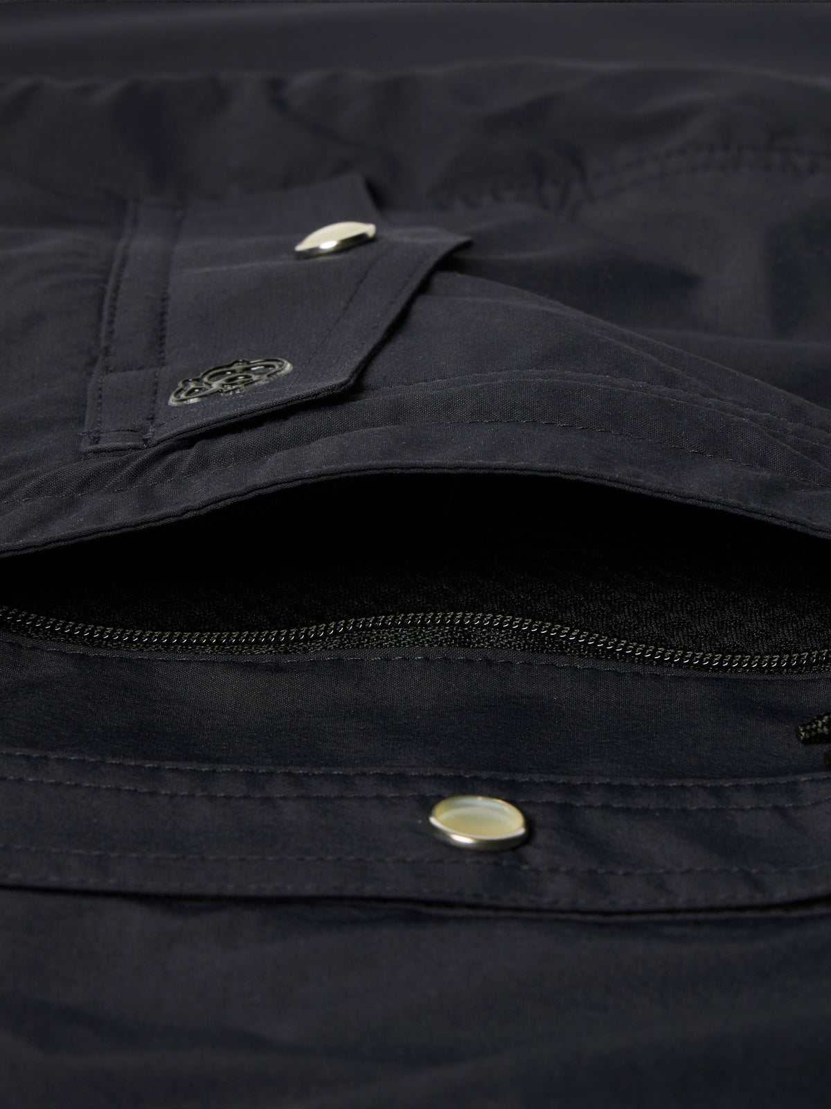 Black western snap shirt close-up of chest pocket flap with metal snap