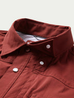 Oxblood snap-front western shirt with buttoned collar and top placket