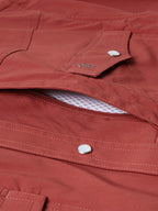 Oxblood snap pocket with open flap and contrast mesh lining at placket