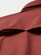 Oxblood shirt collar and shoulder with smooth fabric and structured seam