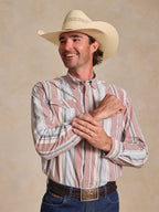 Men’s striped western snap shirt with long sleeves and pointed yoke, worn with tan cowboy hat