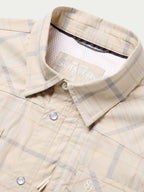 Snap shirt neckline detail, cream with blue plaid, snap collar and inner brand tag.