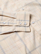 Snap shirt pocket and front placket detail, cream with blue plaid, snap tabs and buttons.