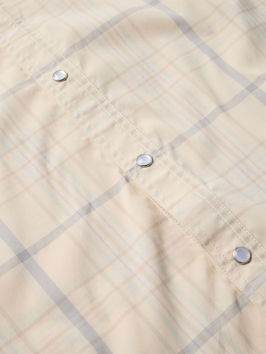 Tan plaid western snap shirt, metal snap buttons and stitched yoke seam