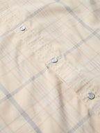 Tan plaid western snap shirt, metal snap buttons and stitched yoke seam