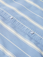 Light blue striped snap front shirt with two chest snap buttons