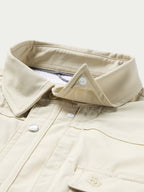 Khaki snap-front Western shirt collar and placket with metallic buttons