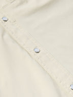 Khaki Western snap shirt with buttoned placket and diagonal stitch lines