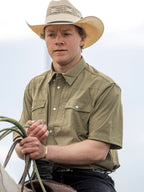 Olive short-sleeve snap western shirt worn by model, front view with chest pocket