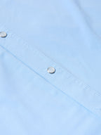 Light blue short-sleeve snap shirt placket with metal snaps and stitched seams