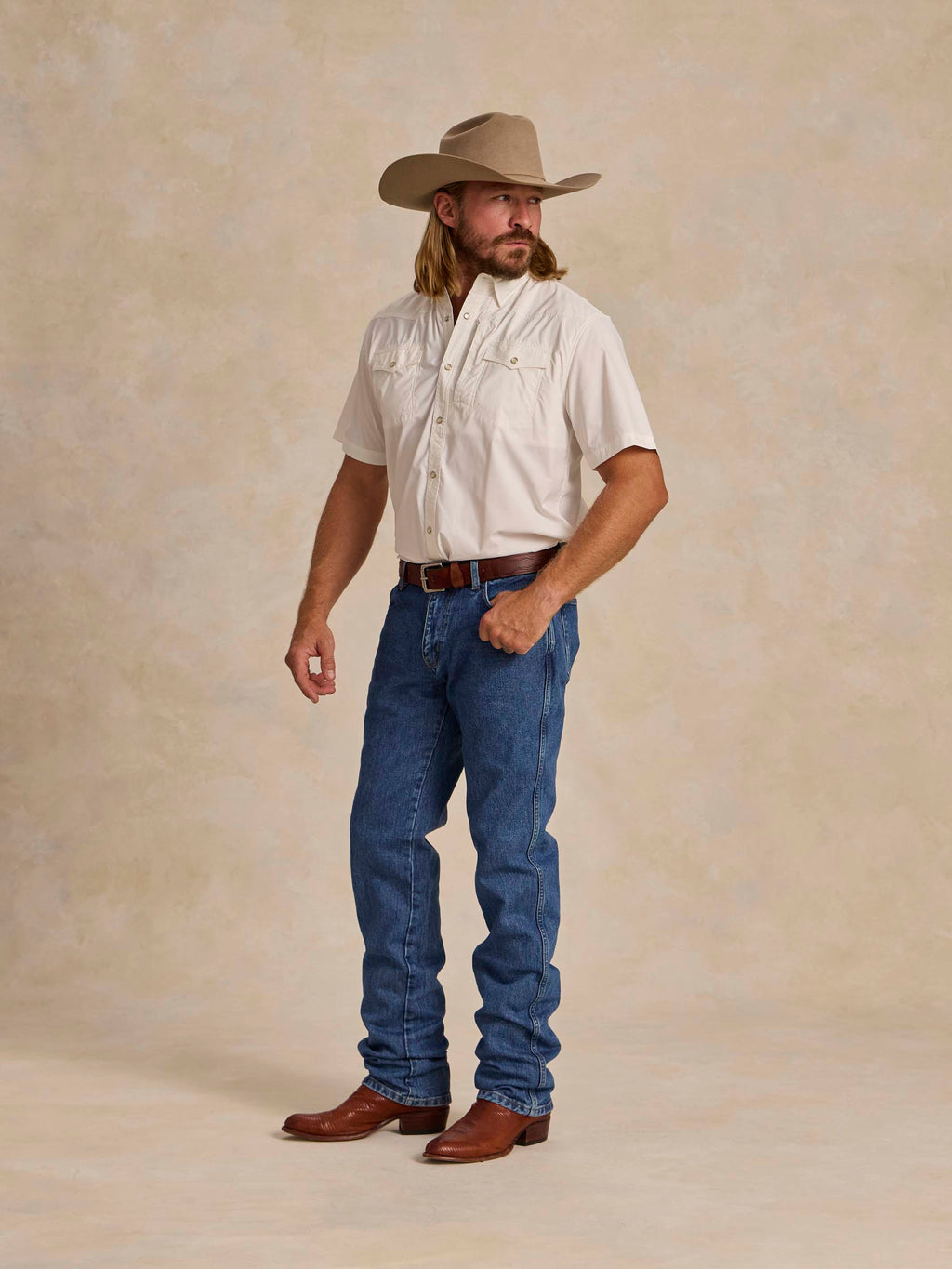 White short-sleeve snap western guide shirt with two chest pockets, worn by model