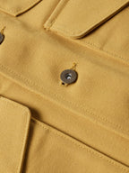 Suntan brushcloth vest button and stitched placket close-up