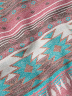 Close-up of colorful patterned fabric lining inside the denim vest
