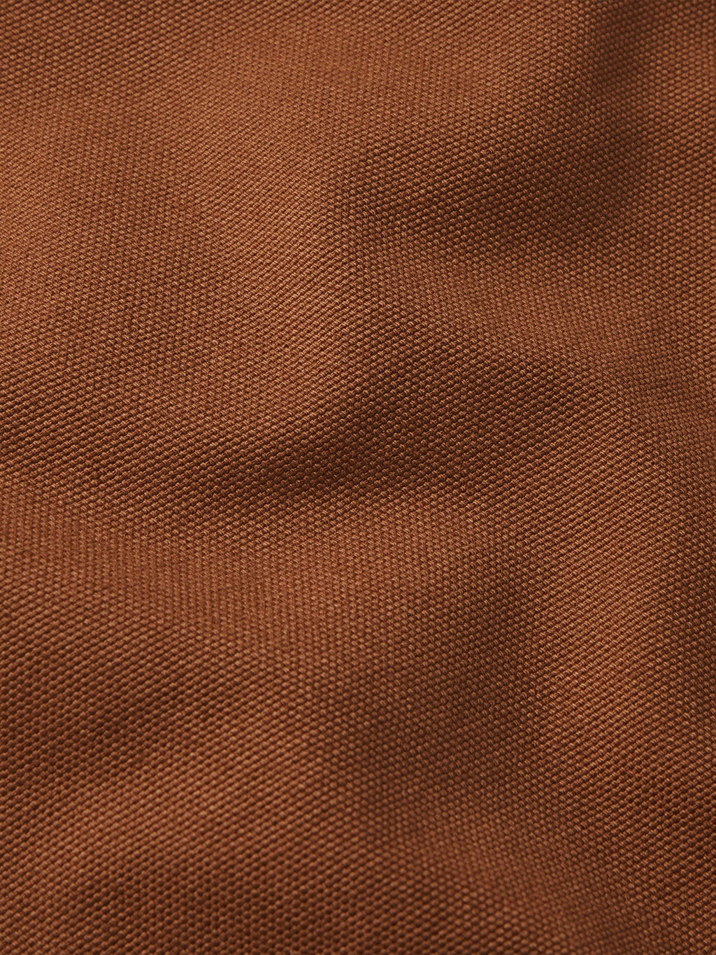 Russet canvas fabric texture close-up, showing fine woven pattern