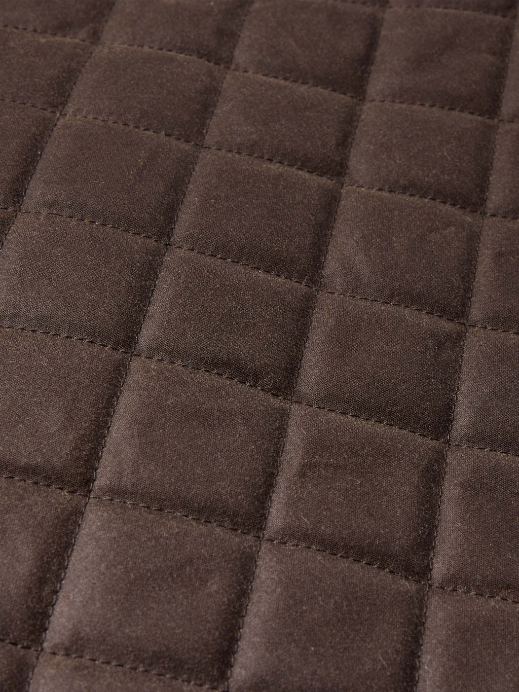 Dark brown quilted diamond pattern fabric