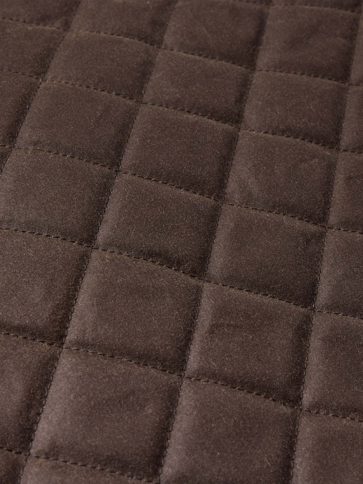 Dark brown quilted diamond pattern fabric