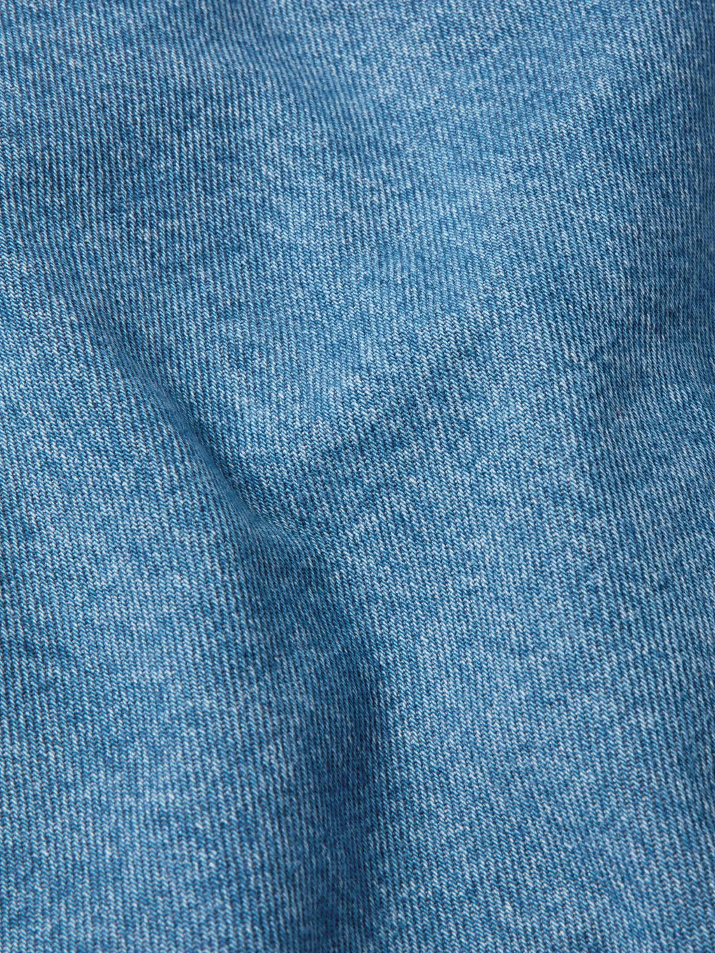 Medium indigo denim fabric close-up texture