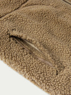 Taupe fleece jacket hem with metal zipper