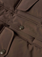 Bozeman down vest close-up of brown placket with snap buttons